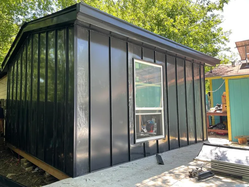 Black standing seam metal wall panels for Roof Inspection in Storm Lake